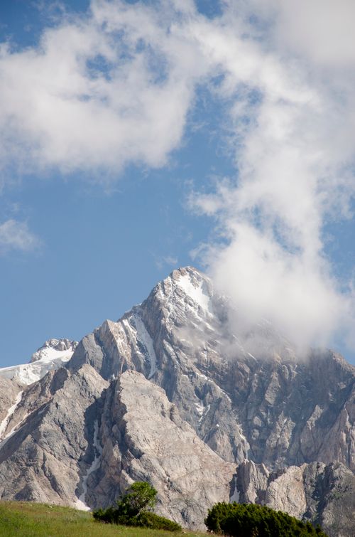 Free Stunning view of towering mountain peaks and clouds in Shymkent, Kazakhstan, during summer. Stock Photo