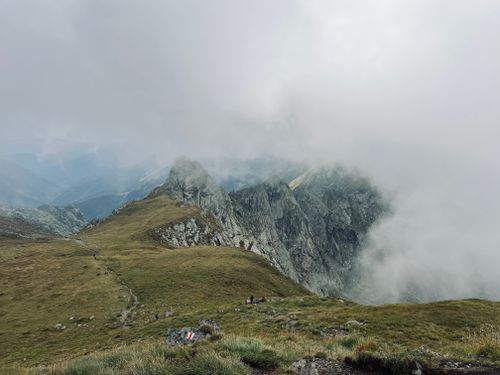 Free A breathtaking view of the mist-covered Carpathian Mountains with rugged peaks. Stock Photo