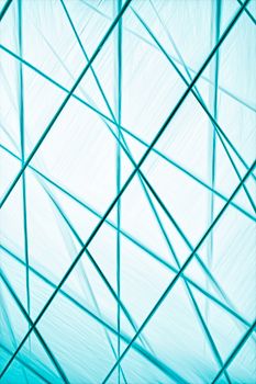 Dynamic blue geometric pattern with intersecting diagonal lines creating a modern and futuristic design.
