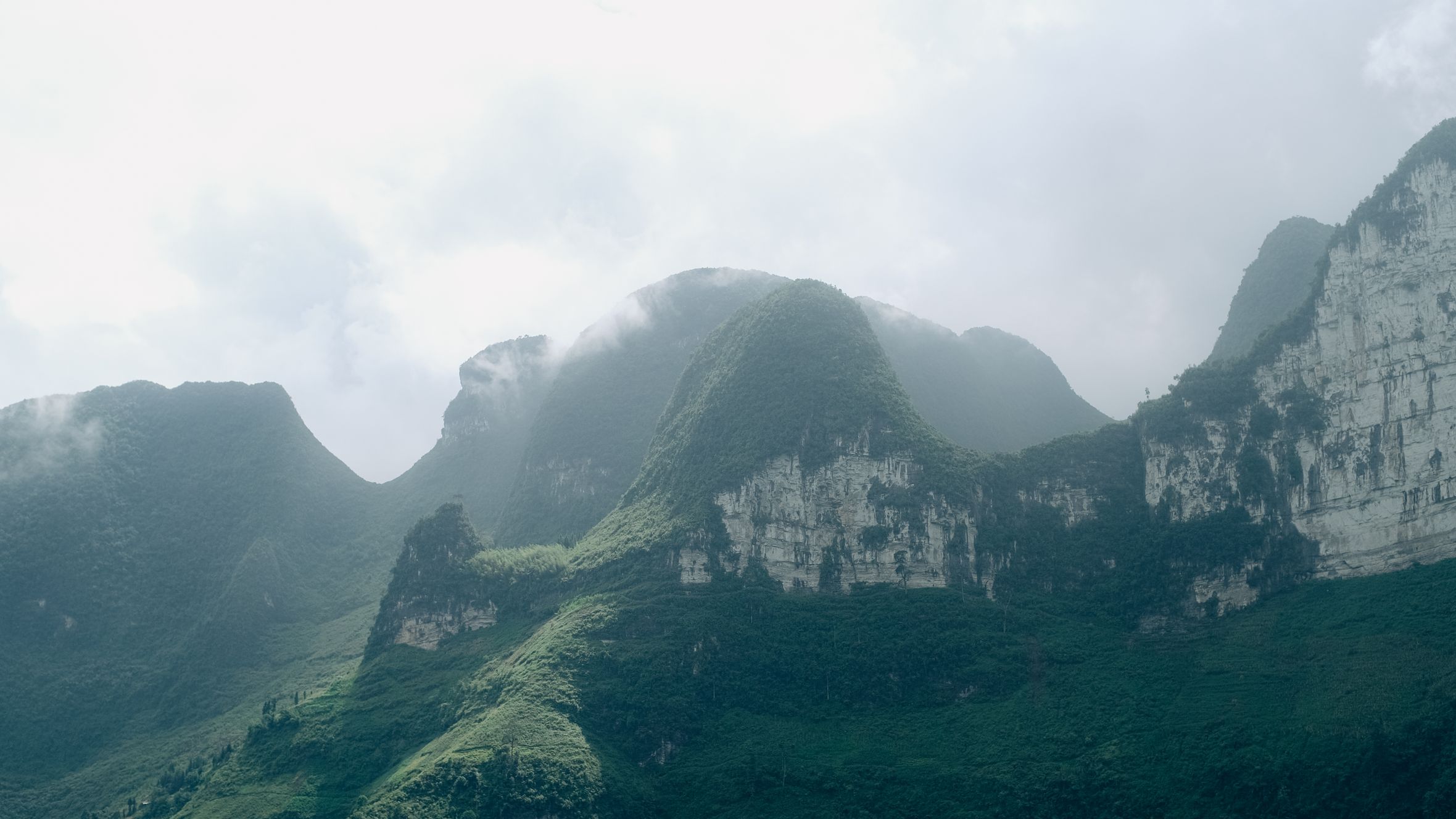 Breathtaking misty mountain panorama from Hà Giang, Vietnam.