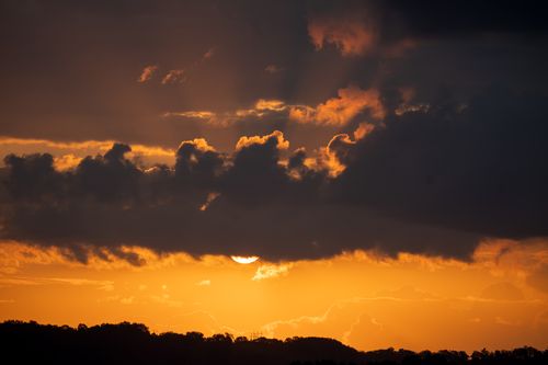Free Breathtaking sunset view with silhouetted clouds and vivid colors in Kellogg, MN. Stock Photo