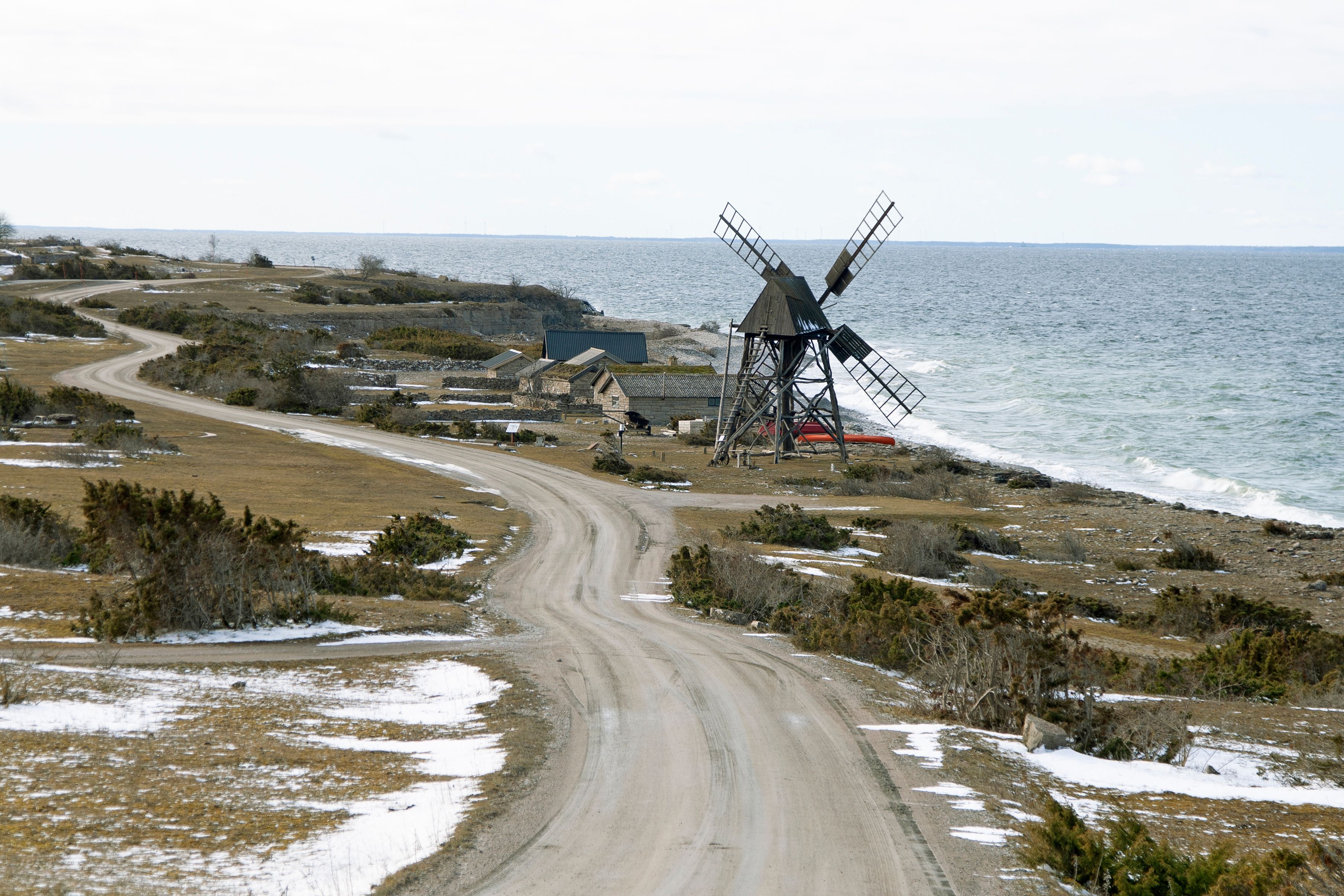 Beautiful coastal landscape on Öland, Sweden, featuring an old windmill by the sea.