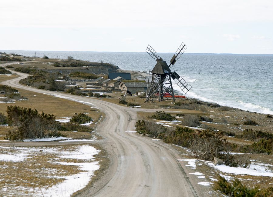 Beautiful coastal landscape on Öland, Sweden, featuring an old windmill by the sea.