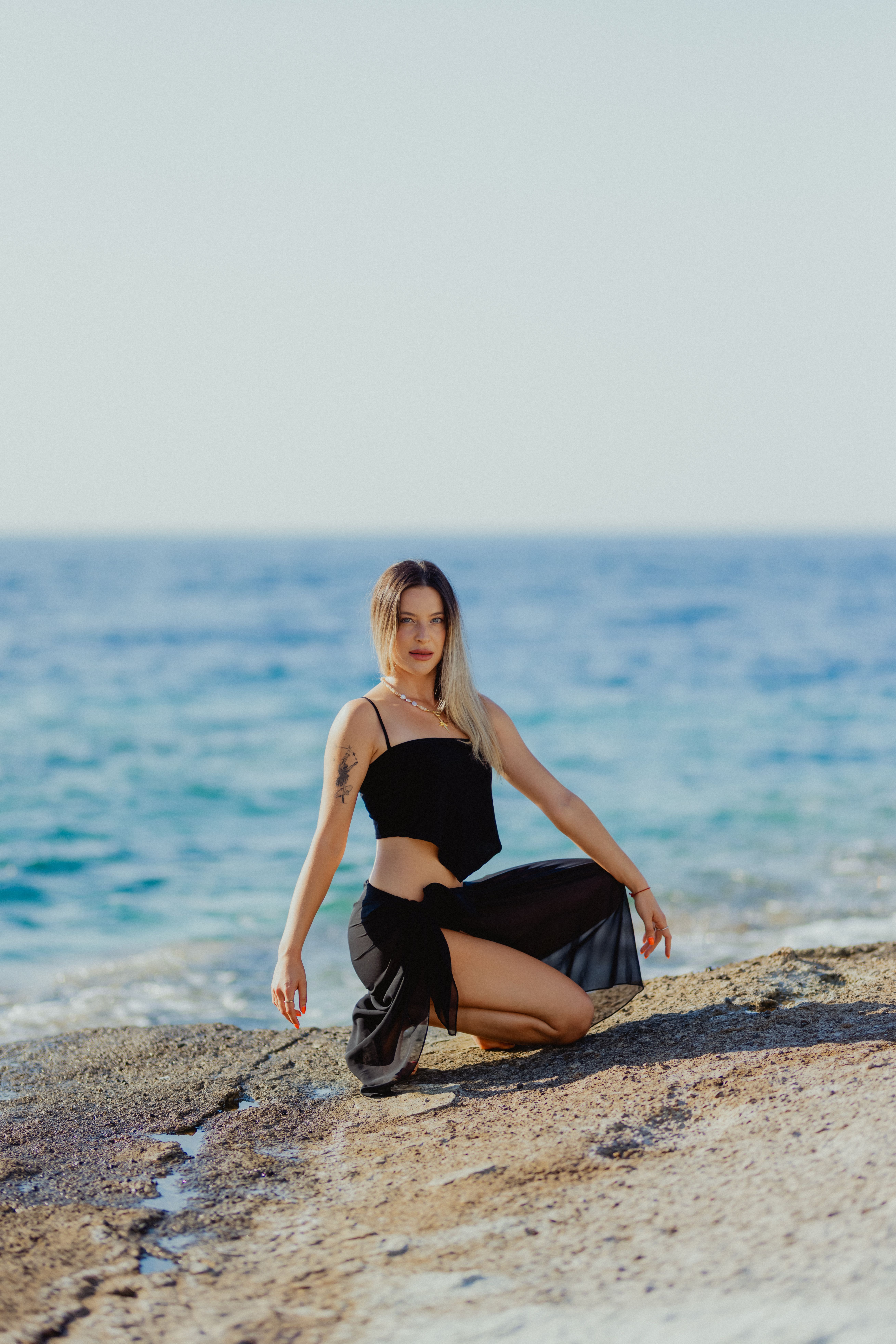 Woman in Black Bikini on Seashore · Free Stock Photo