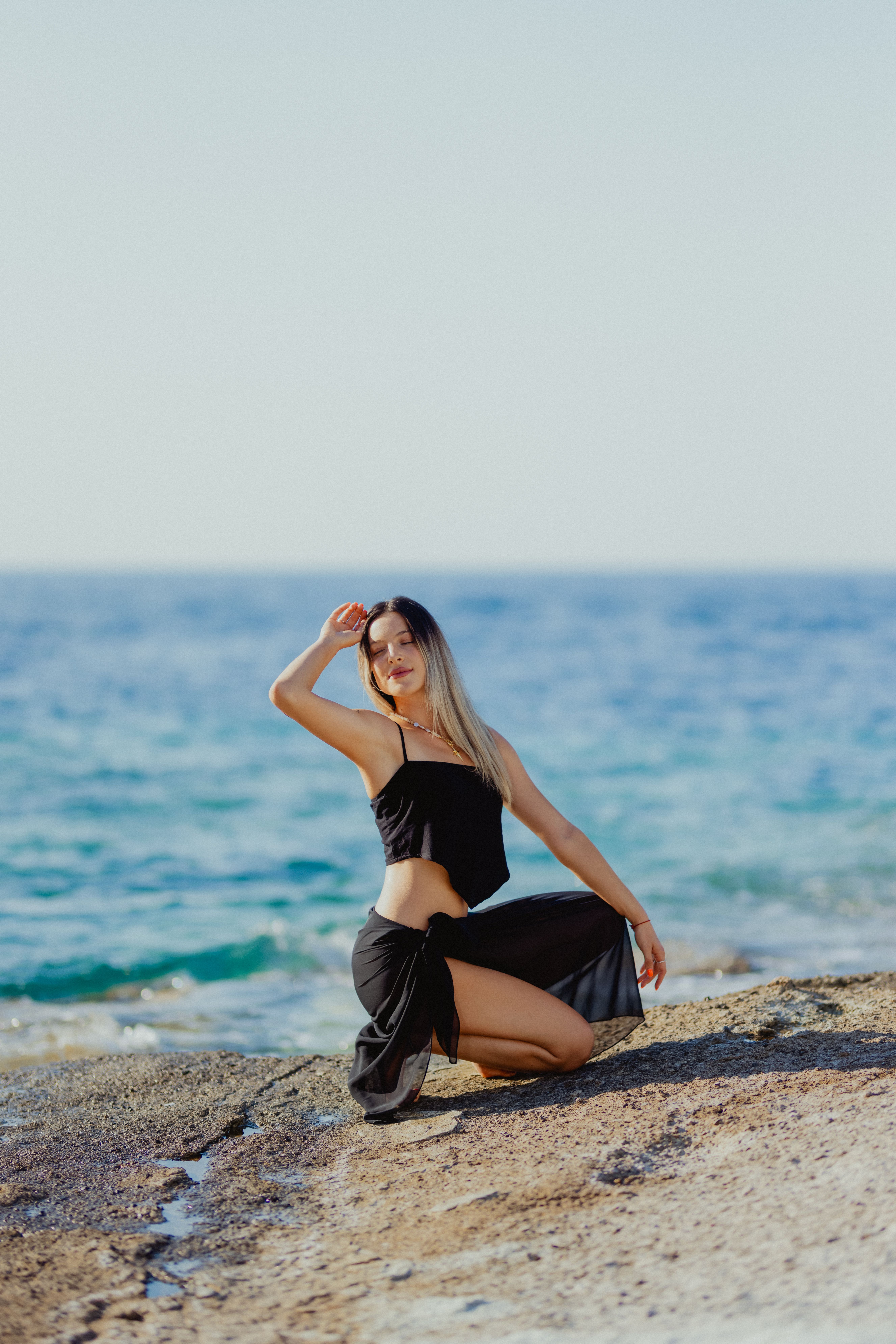 Woman in Black Bikini on Seashore · Free Stock Photo