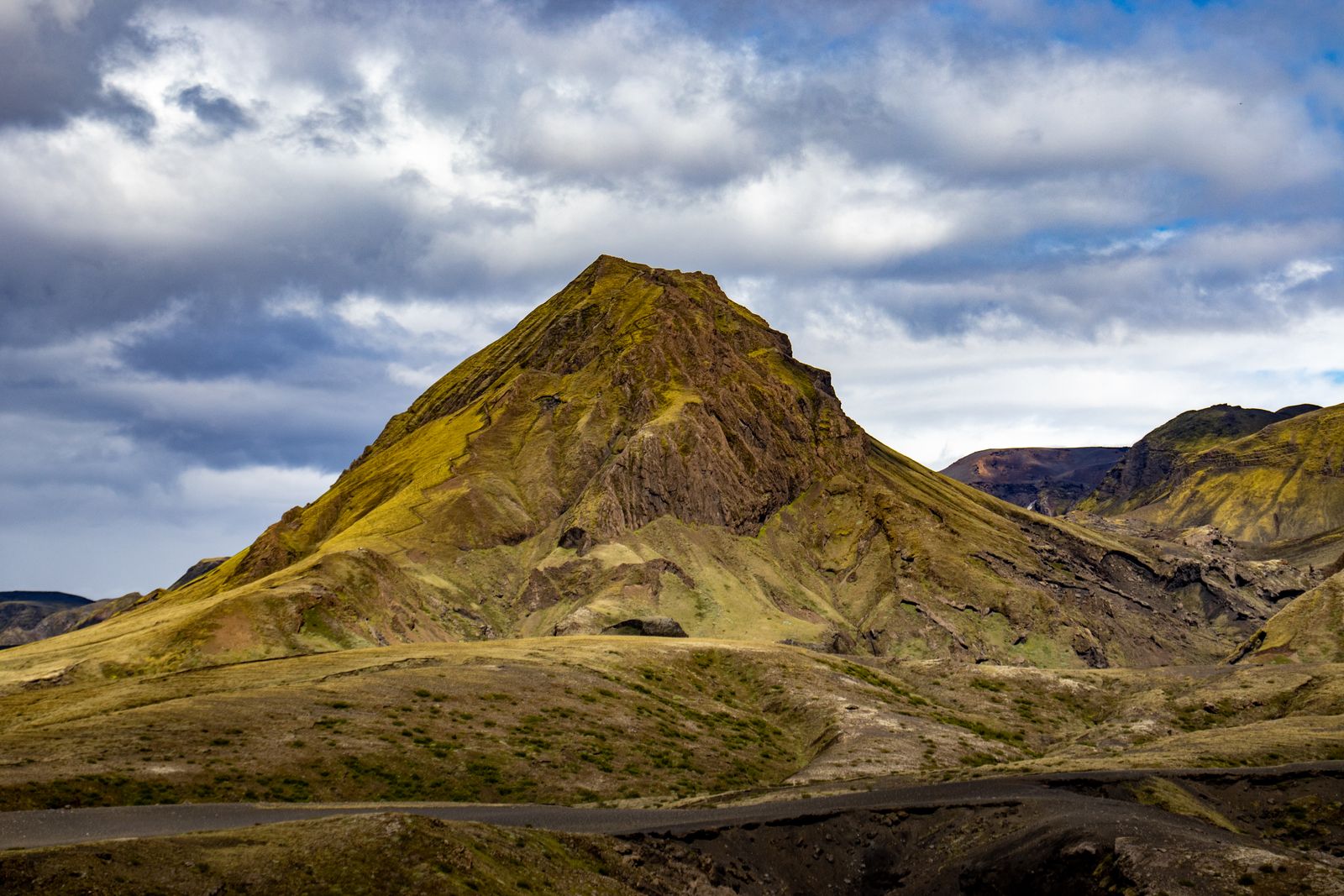 Rugged mountain ridge under a dramatic sky, photo by Jędrzej Koralewski on Pexels