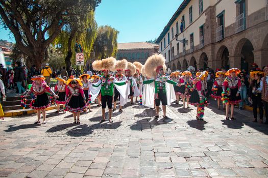 Vibrant traditional festival parade in Cusco, showcasing cultural costumes and dance.