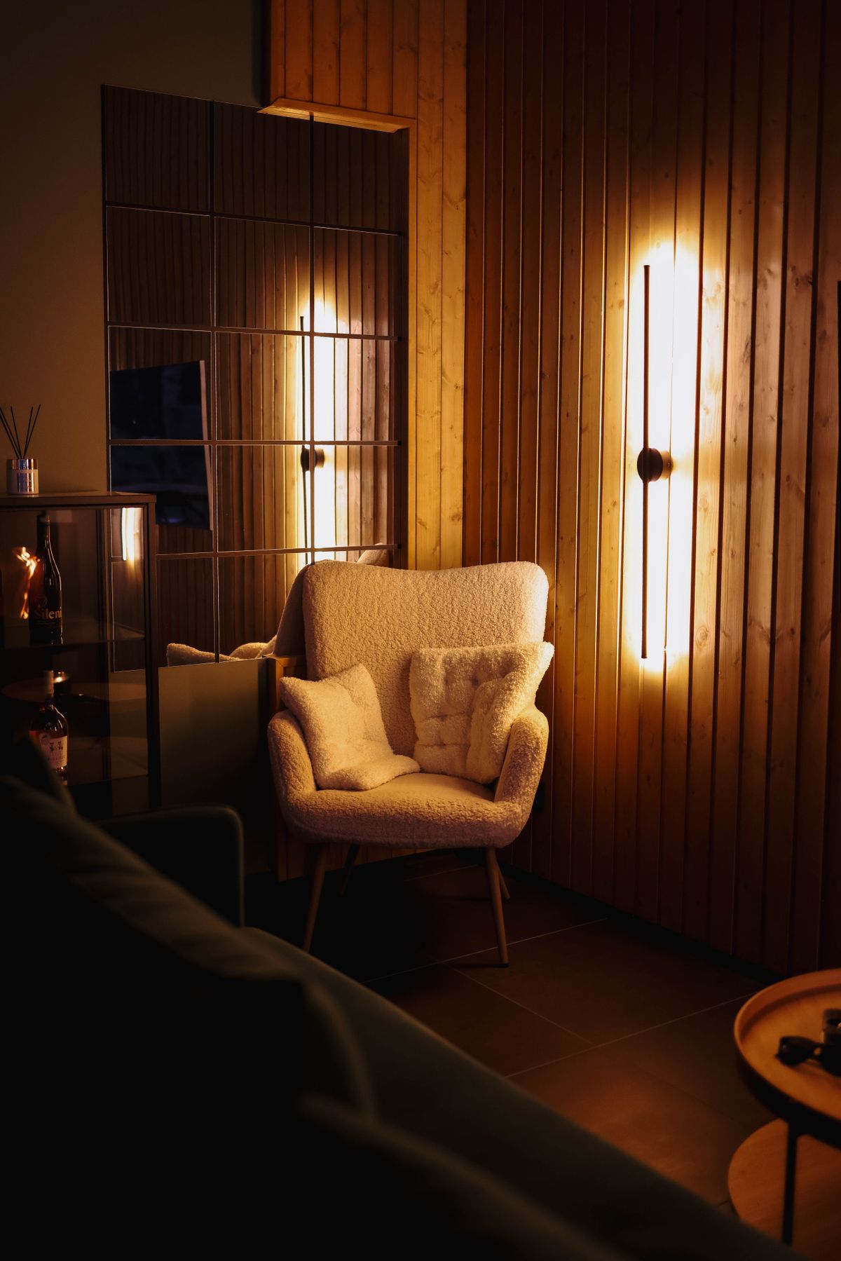 Warm minimalist interior featuring a premium statement armchair