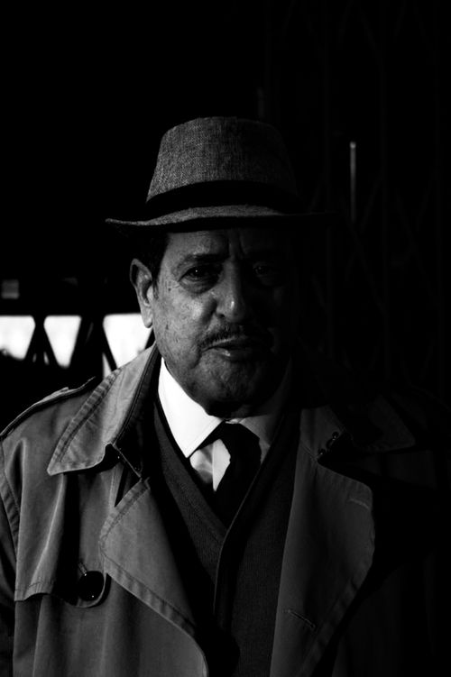Free Moody black and white portrait of a man in a fedora, captured in Fès, Maroc. Stock Photo
