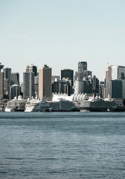 Downtown Vancouver is the city's bustling heart, encompassing vibrant neighborhoods like Yaletown, West End, and Coal Harbour. The image might showcase the sleek skyscrapers of Coal Harbour set against the backdrop of the shimmering Burrard Inlet and Stanley Park. Yaletown could be represented by its chic waterfront vibe, historic redbrick buildings, and trendy restaurants, while the West End offers a mix of modern condos and charming heritage homes nestled near lush parks and the famous English Bay beaches. Together, these areas create a dynamic urban core with a perfect balance of natural beauty, luxury living, and vibrant culture.Downtown Vancouver is the city's bustling heart, encompassing vibrant neighborhoods like Yaletown, West End, and Coal Harbour. The image might showcase the sleek skyscrapers of Coal Harbour set against the backdrop of the shimmering Burrard Inlet and Stanley Park. Yaletown could be represented by its chic waterfront vibe, historic redbrick buildings, and trendy restaurants, while the West End offers a mix of modern condos and charming heritage homes nestled near lush parks and the famous English Bay beaches. Together, these areas create a dynamic urban core with a perfect balance of natural beauty, luxury living, and vibrant culture.