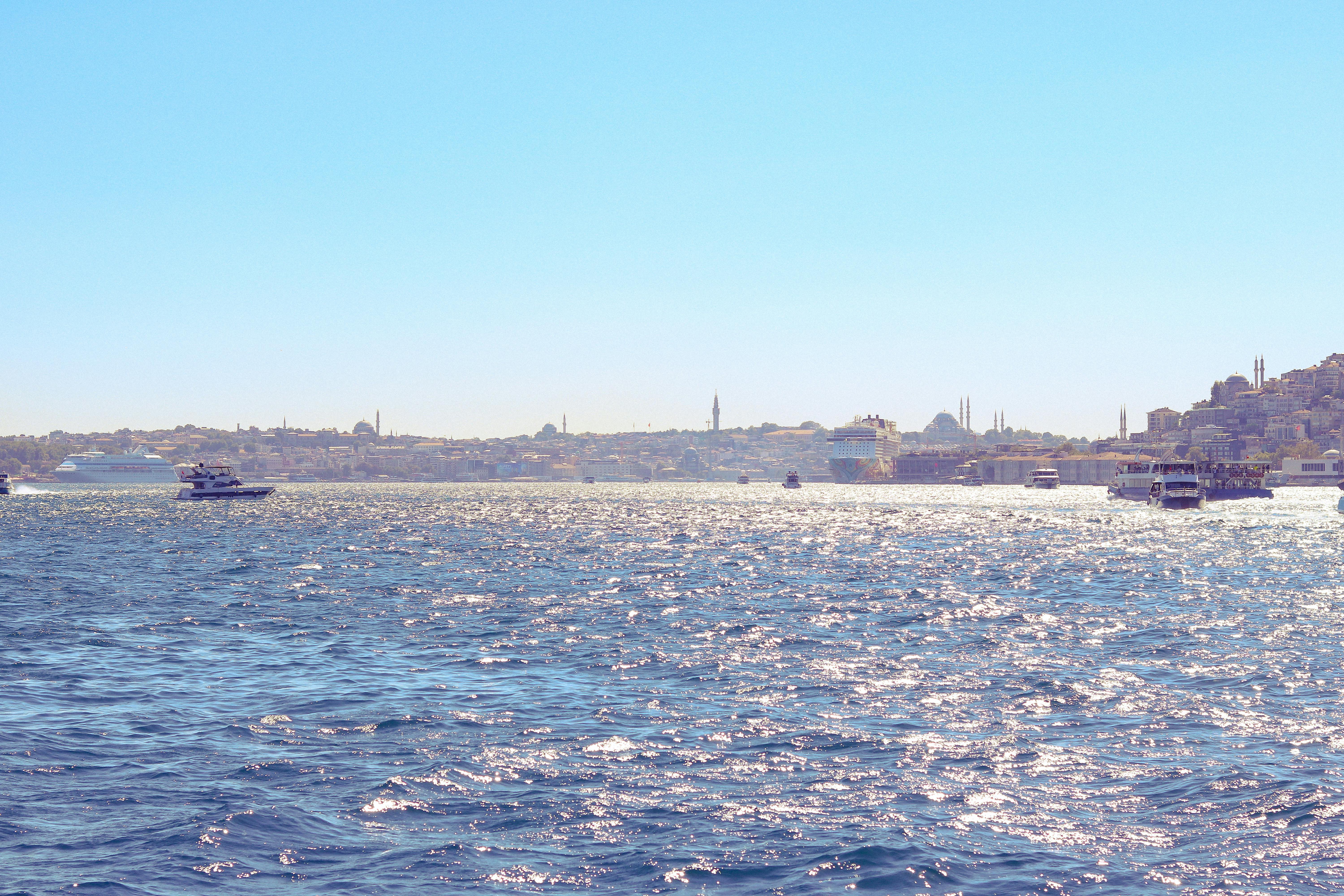 a view of the water with boats and buildings