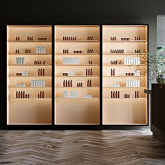 Backlit retail shelving stocked with beauty and wellness products, photo by Ela De Pure on Pexels