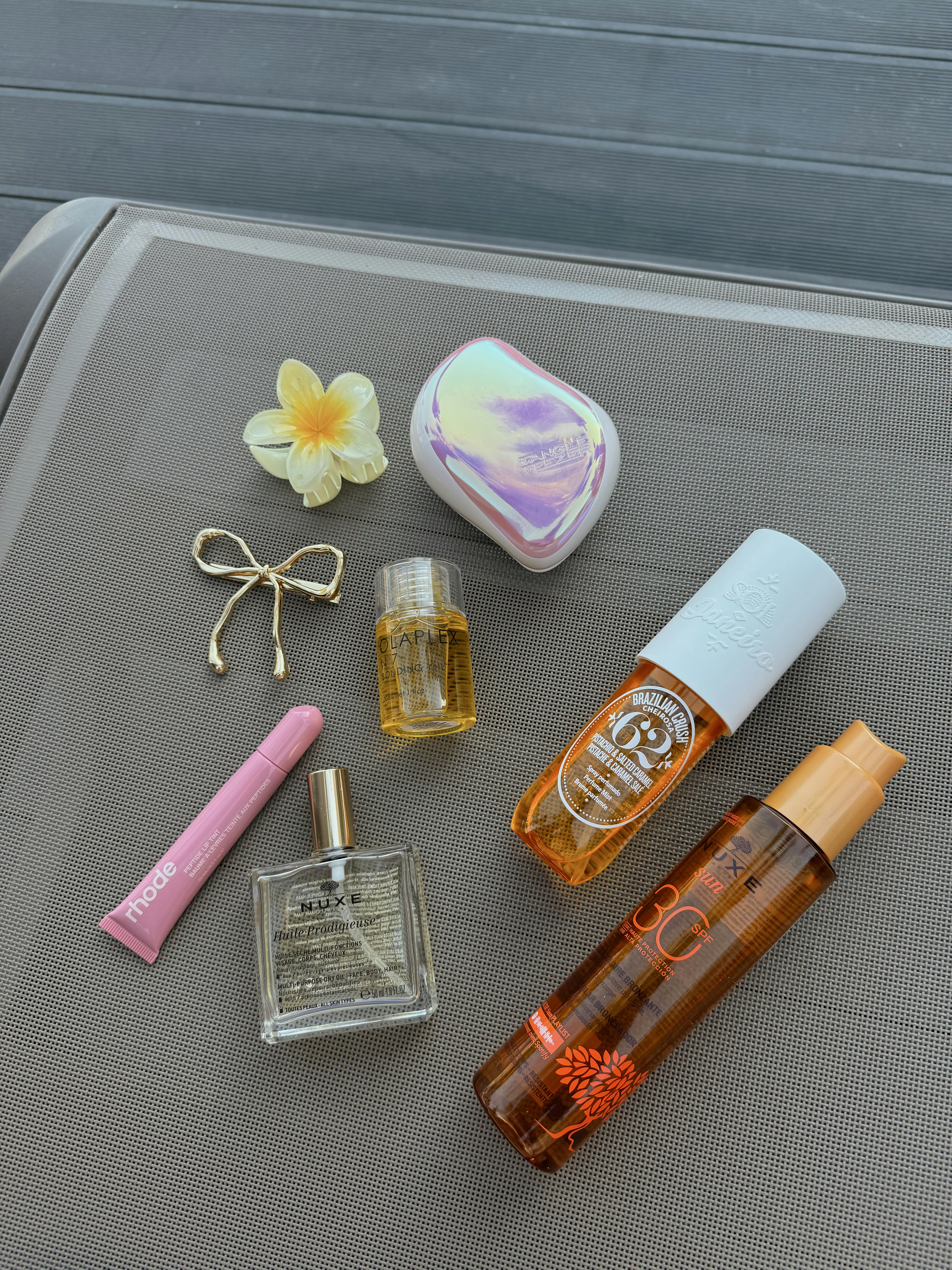 A variety of beauty products on a plane · Free Stock Photo