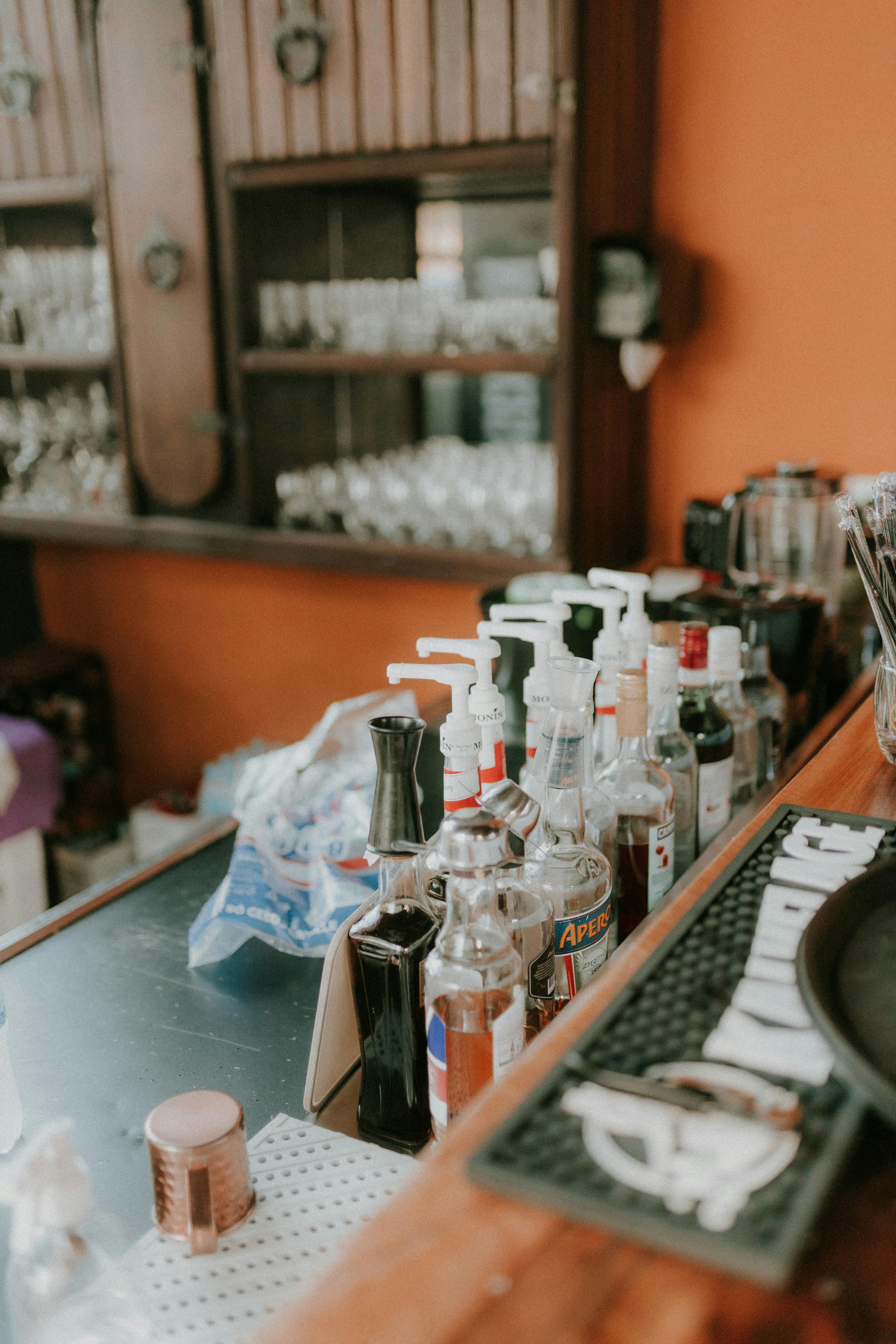 a bar with bottles and glasses on it