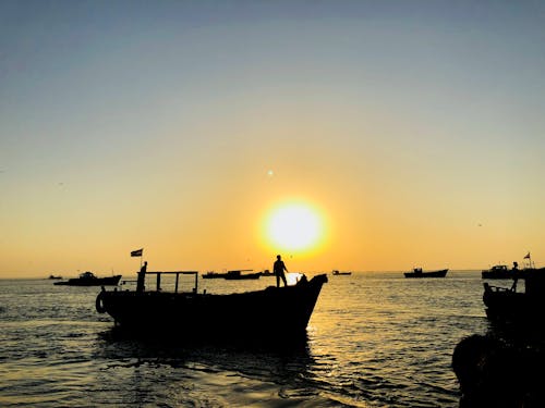 balıkçı, deniz, gün batımı içeren Ücretsiz stok fotoğraf