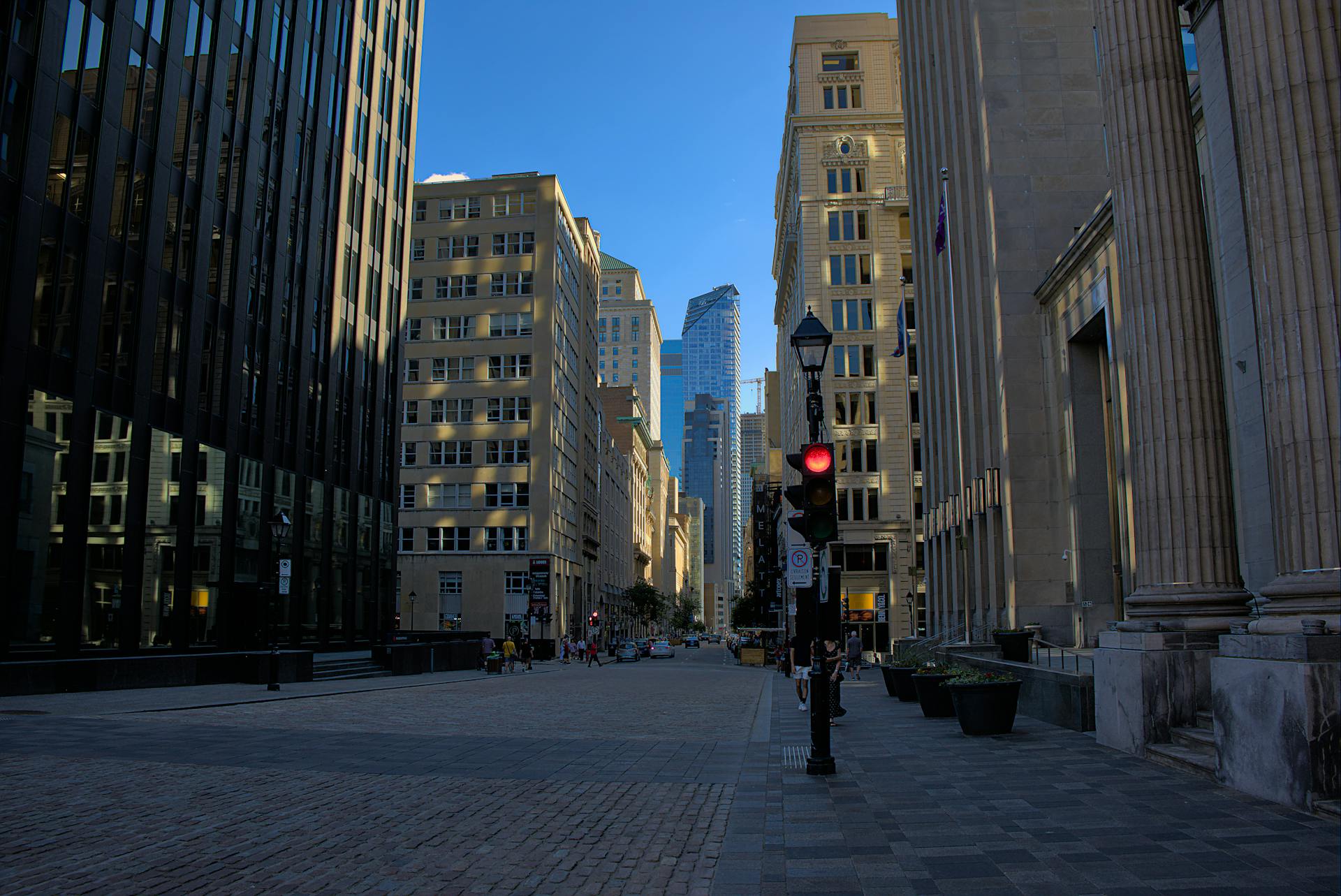 Explore the dynamic cityscape of Montreal with towering skyscrapers and vibrant street life.