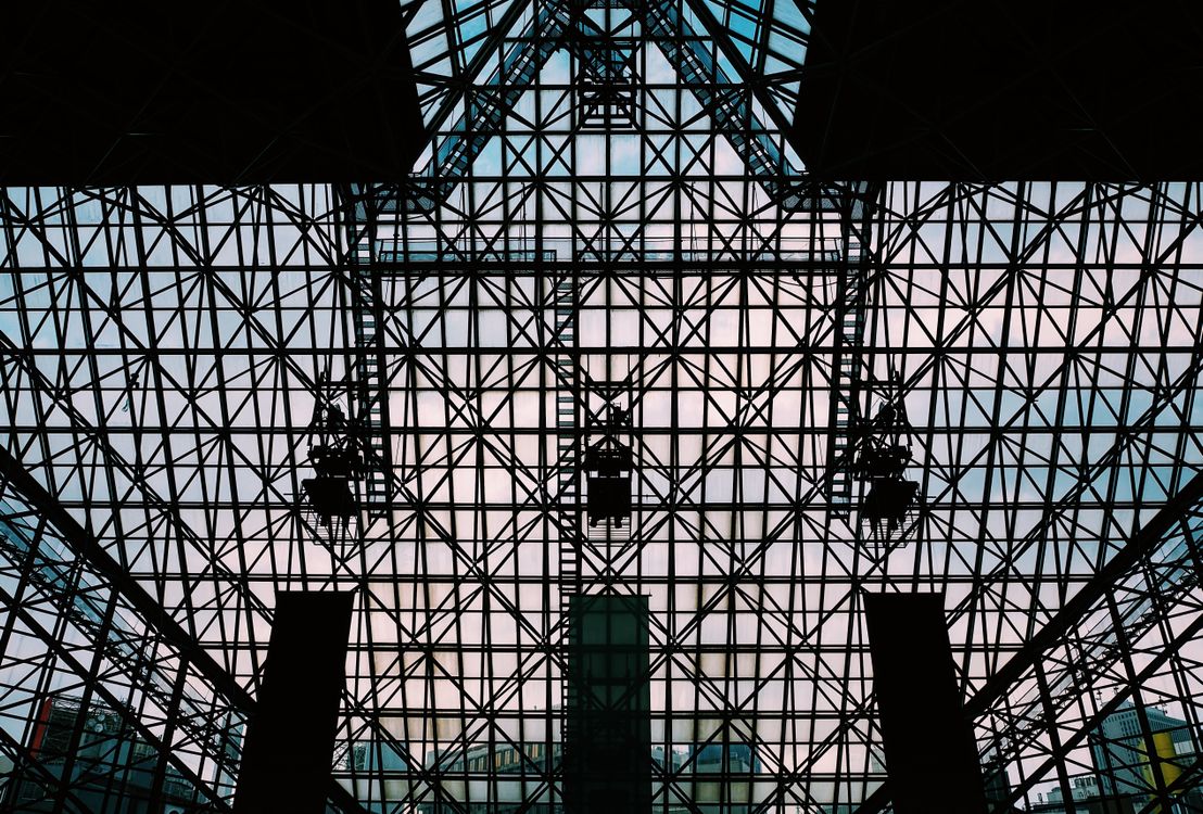 The inside of a building with a glass roof · Free Stock Photo