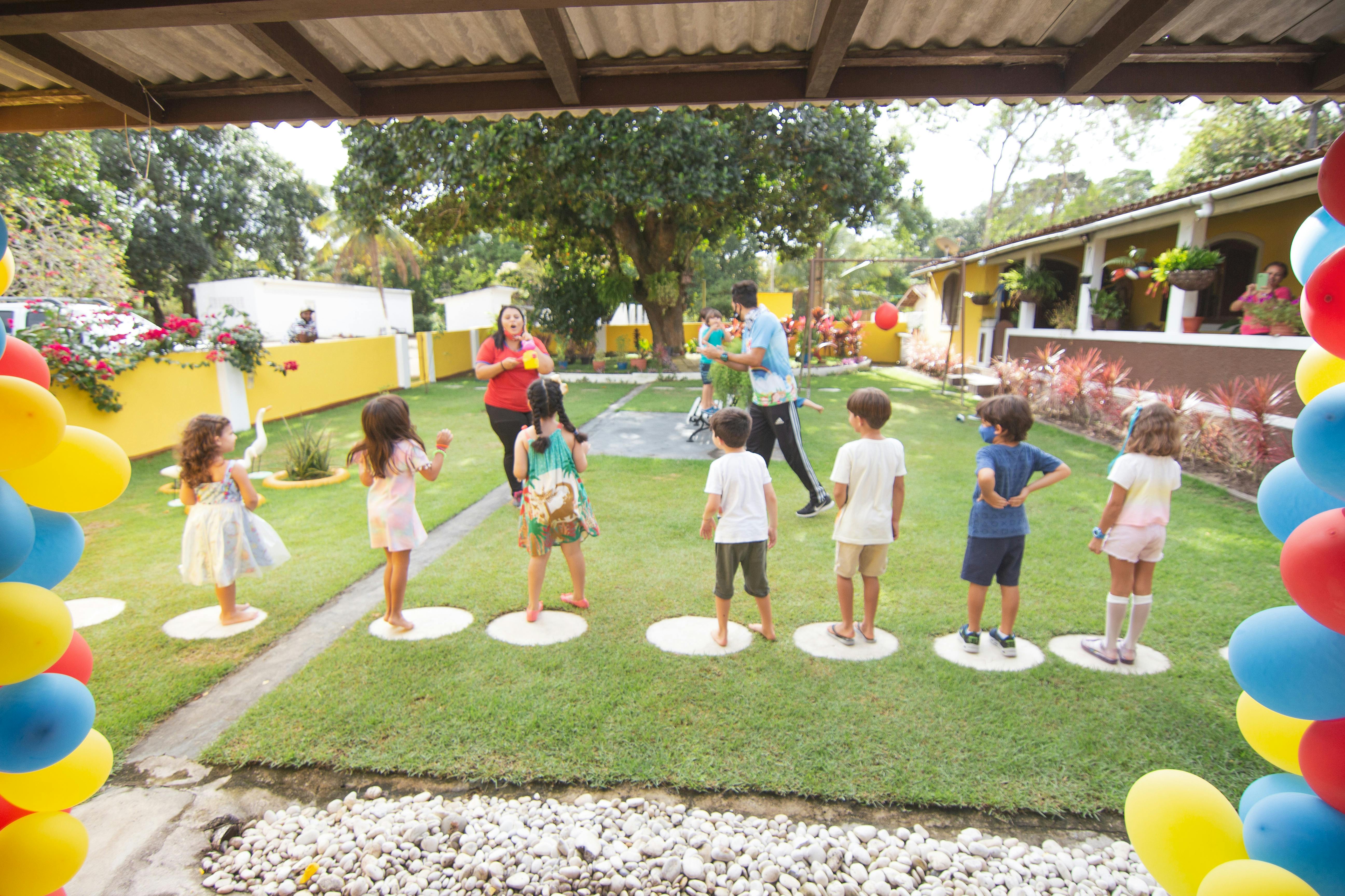 Group of kids having fun at a sports-themed birthday party