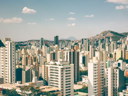 Free A panoramic view of a bustling city skyline showcasing modern architecture and urban landscape. Stock Photo