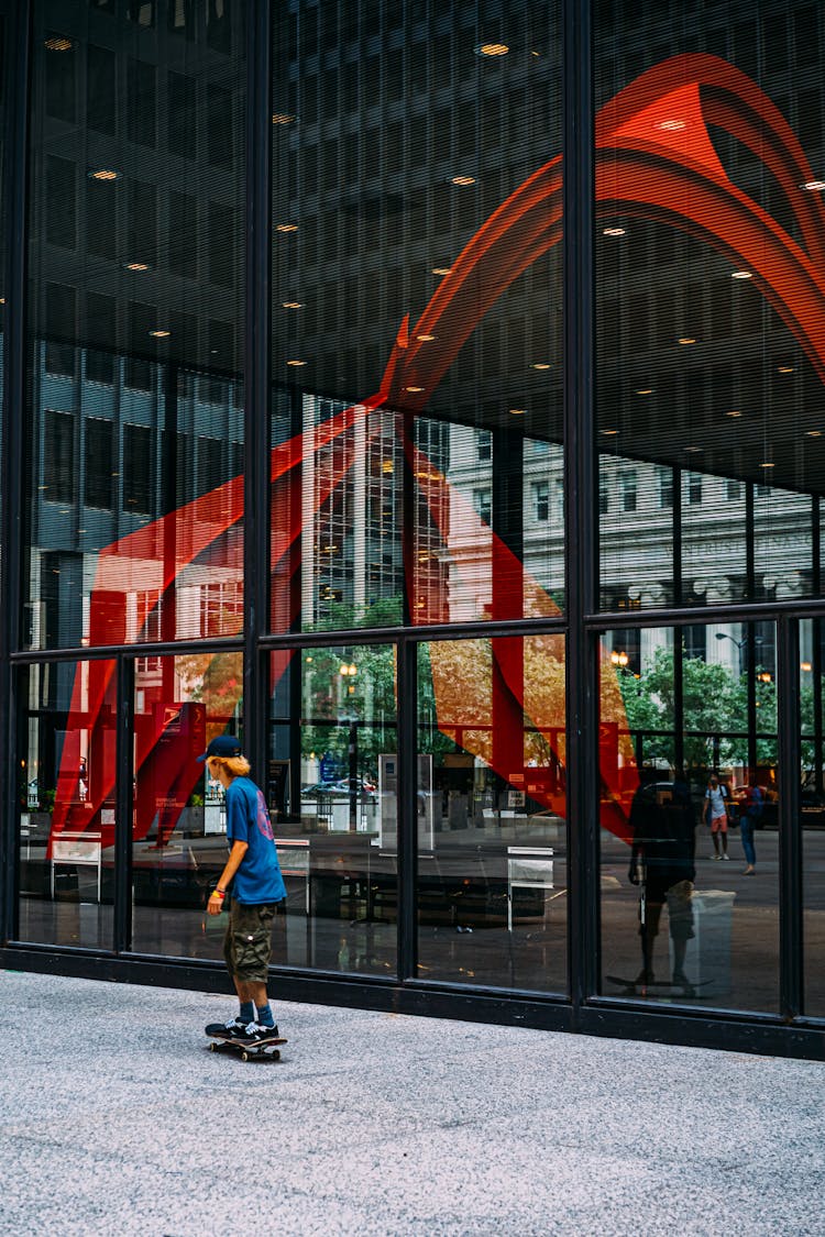 Man Skateboarding Near A Building