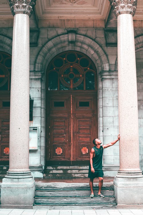 Free Man Standing Near Door Stock Photo