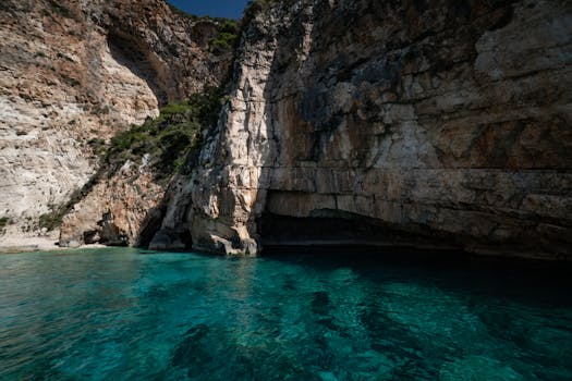 Explore the vibrant turquoise waters and stunning limestone cliffs of this serene seaside location.
