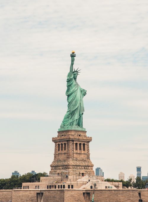 Free View of the Statue of Liberty in New York City, symbolizing freedom and democracy. Stock Photo