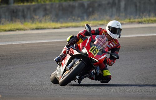 Free High-speed motorcycle racing on a track in Central Luzon, showcasing skill and precision. Stock Photo