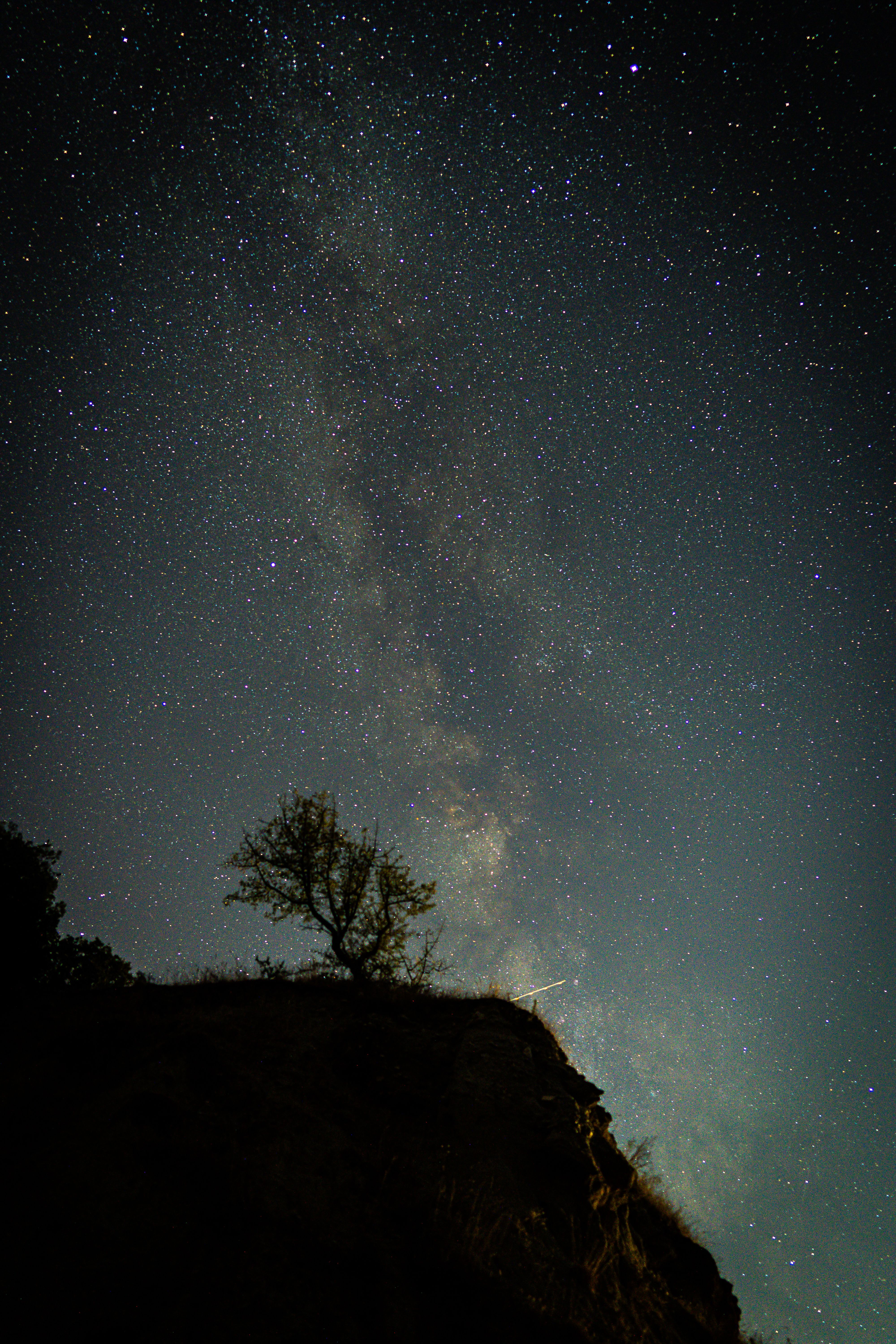 A breathtaking view of the Milky Way galaxy with stars twinkling over the landscape in Kula, Türkiye.