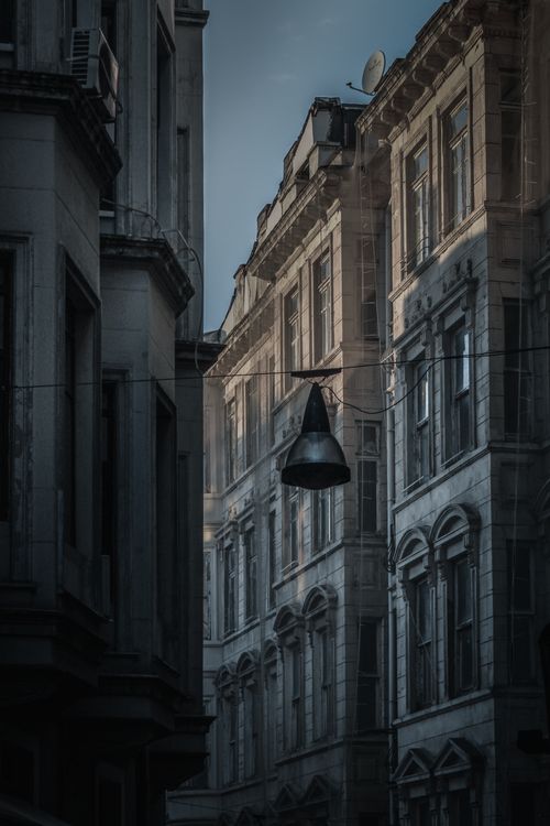 Free Classic urban architecture with vintage details and soft light in a narrow street. Stock Photo