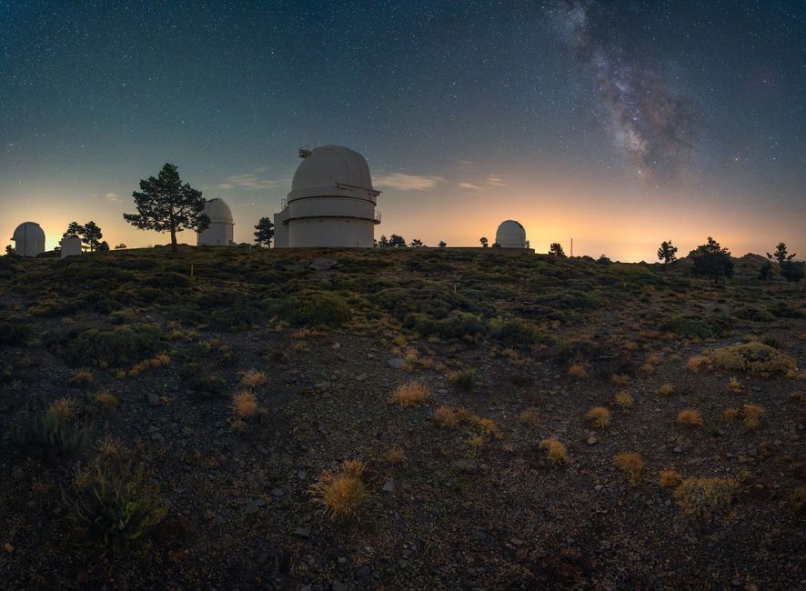 Breathtaking view of observatories beneath a starry night sky, ideal for astrophotography enthusiasts.
