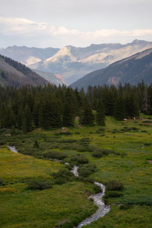 Free Majestic mountain vista in San Juan National Forest with river and lush greenery. Stock Photo