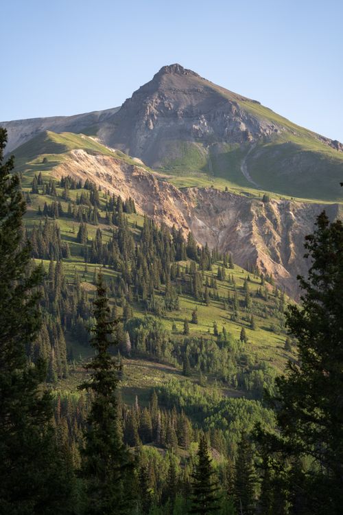 Free Breathtaking view of lush greenery and a majestic mountain in San Juan National Forest. Stock Photo