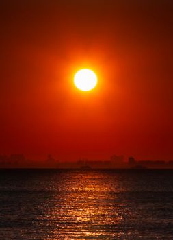 Vivid sunset over the sea with Istanbul skyline silhouette