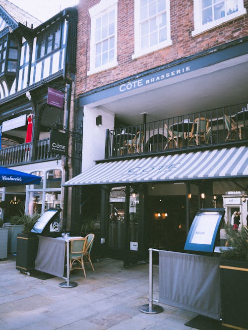 Restaurant With White and Grey Striped Awning