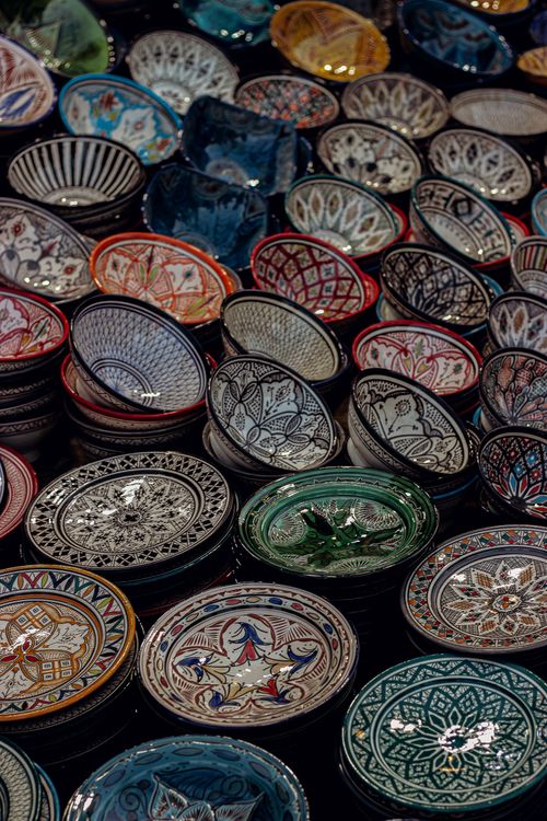Free Vibrant collection of handmade Moroccan pottery showcasing traditional artistry in Marrakesh market. Stock Photo