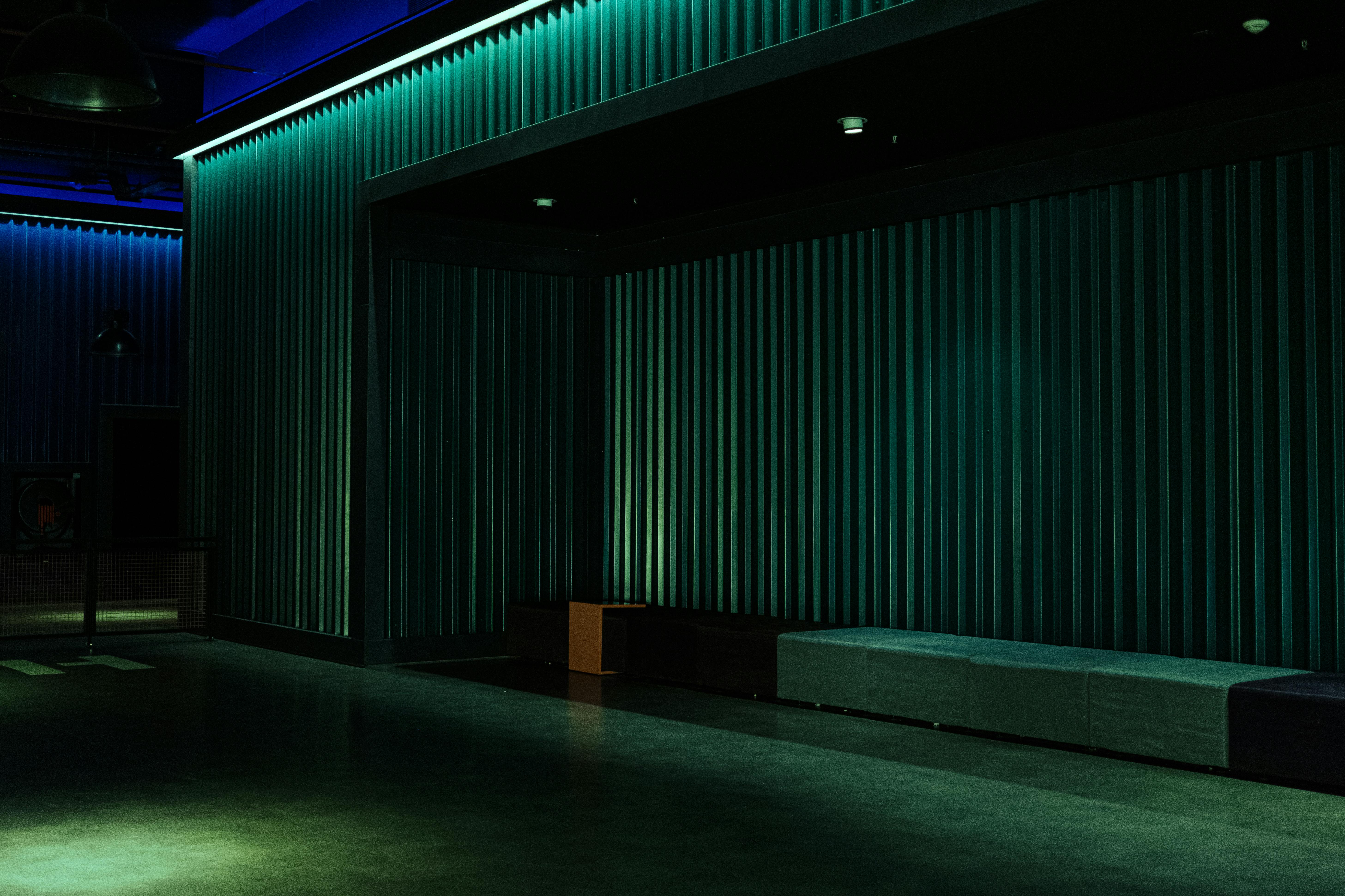 Free Empty theater space with industrial design and dramatic lighting, ideal for performances. Stock Photo