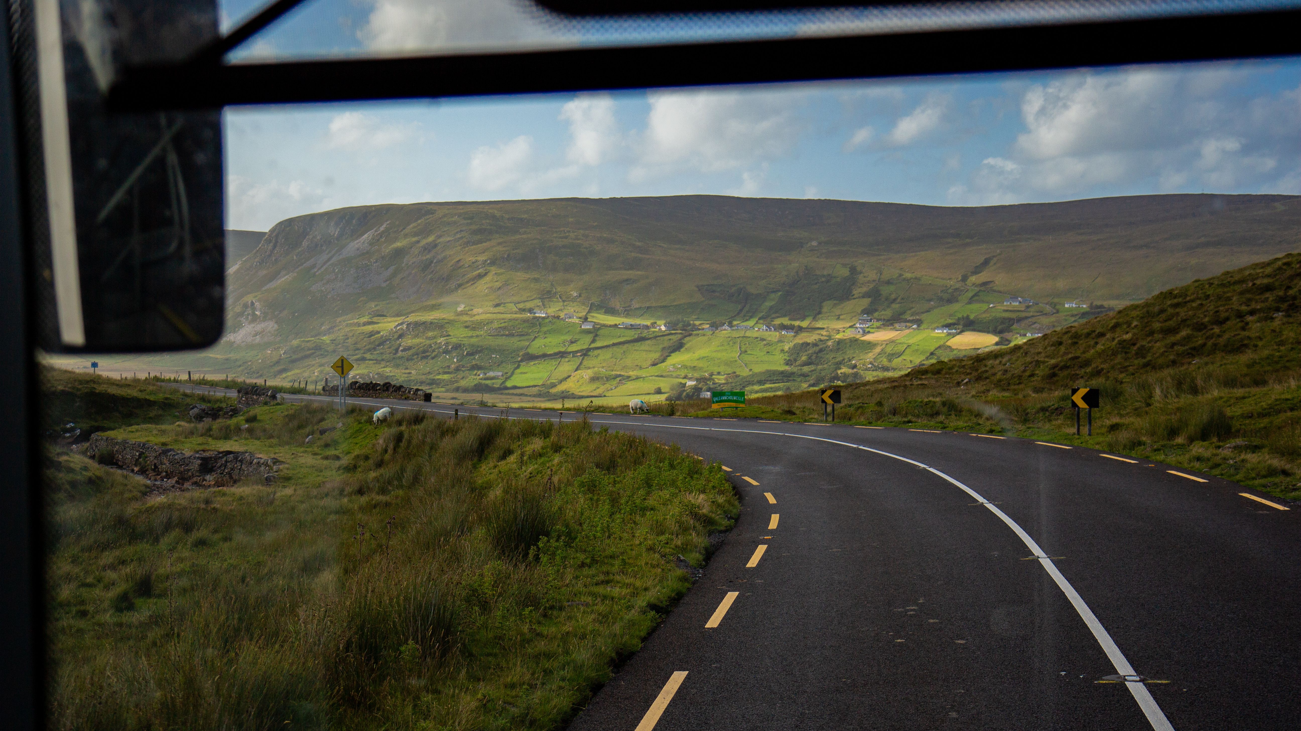 A view of a road from inside a bus · Free Stock Photo