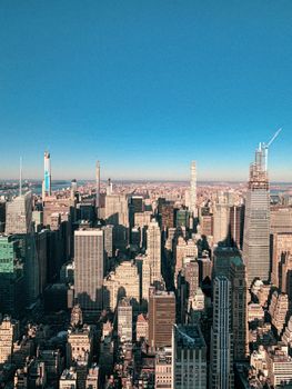 A stunning aerial view of New York City's skyline under a clear blue sky.
