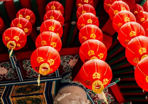Free Colorful red Chinese lanterns adorning a traditional temple setting, symbolizing luck and celebration. Stock Photo