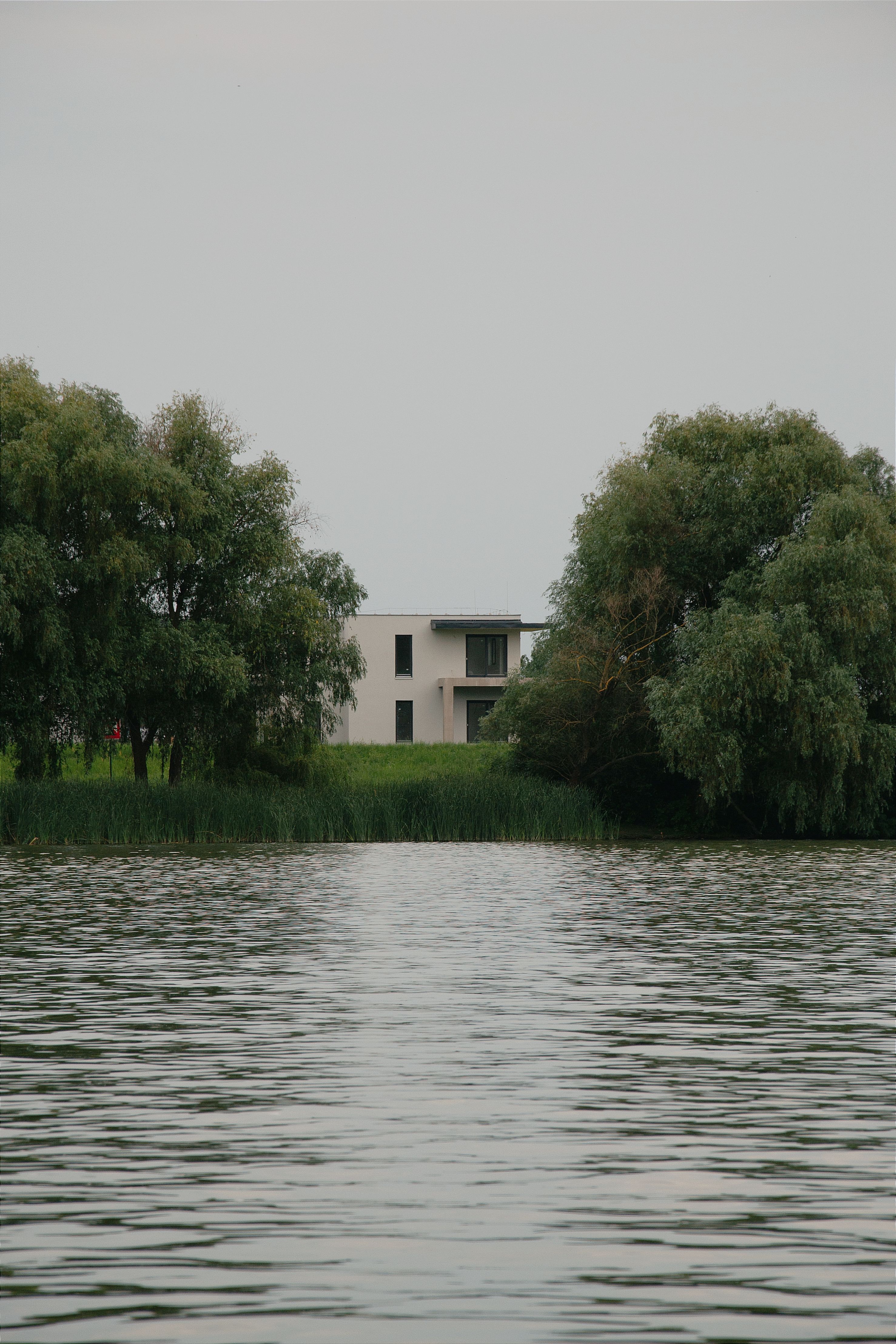 Beautiful modern house surrounded by nature by a tranquil lake in Hungary