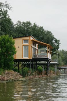 Explore this tranquil riverside bungalow amid lush greenery in Hungary.