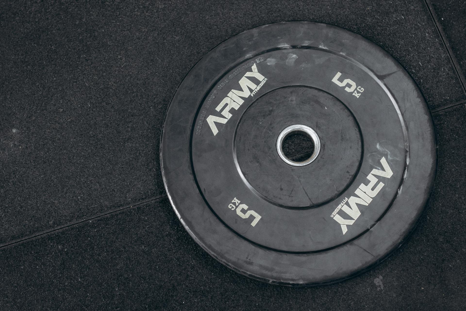 A black and white photo of a weight plate