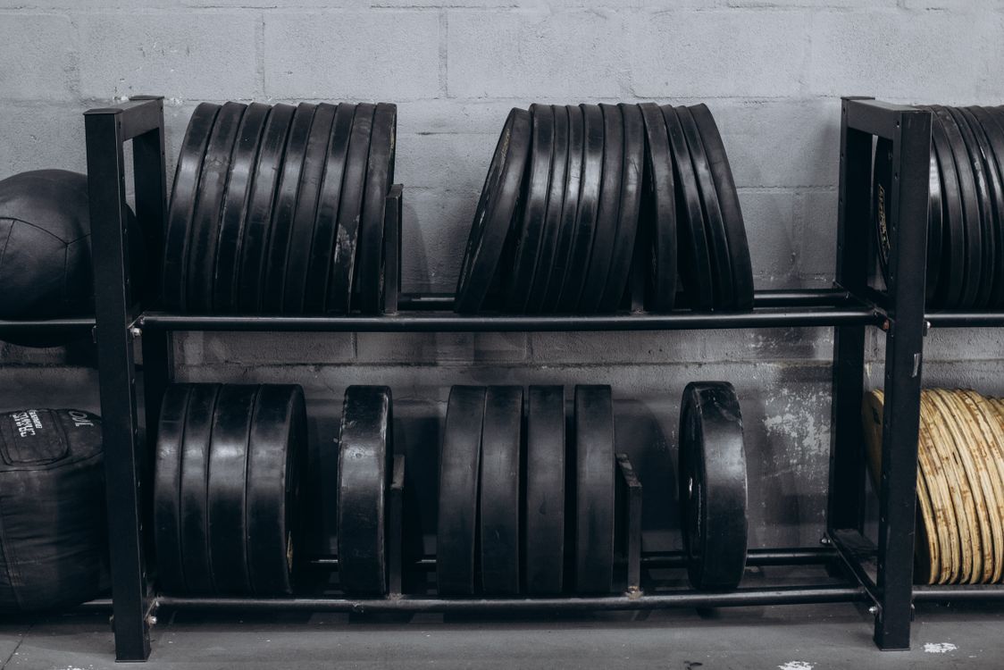 A rack of weights and other equipment in a gym · Free Stock Photo