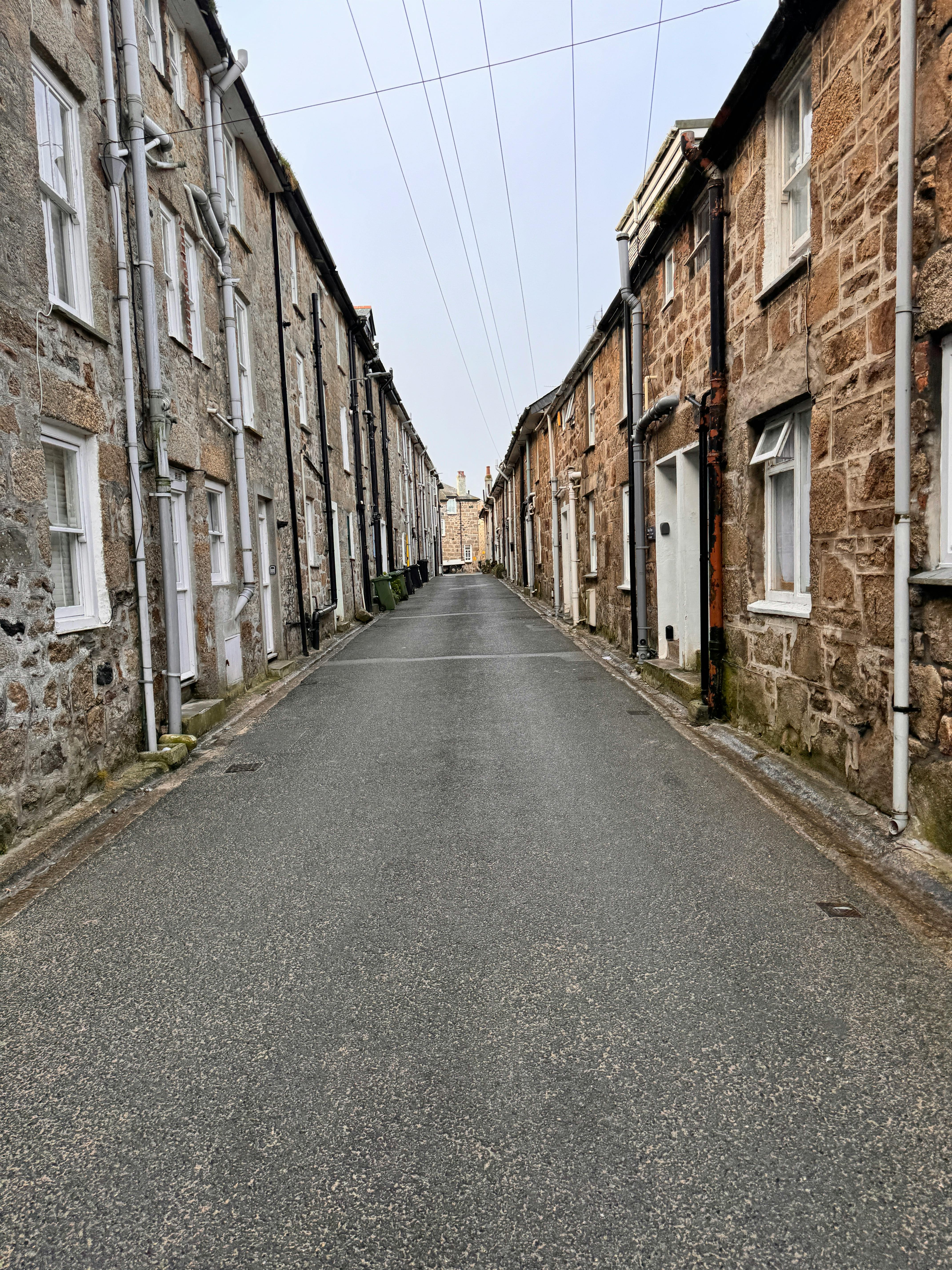 Explore the historic charm of a narrow alley in St Ives, England.
