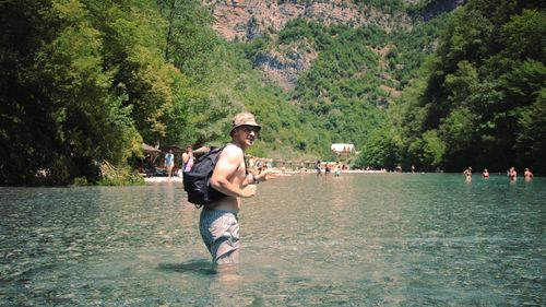 Free A refreshing summer day with people enjoying the river in Shkodër County, Albania. Stock Photo