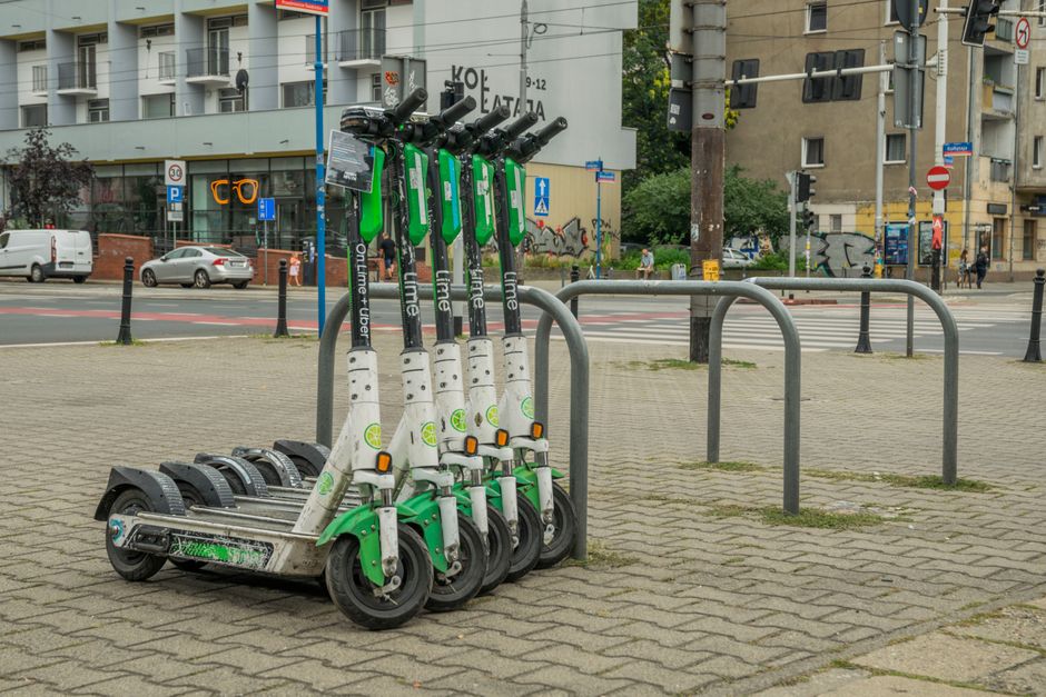 Lime electric scooters parked in Wrocław city center for urban transportation.