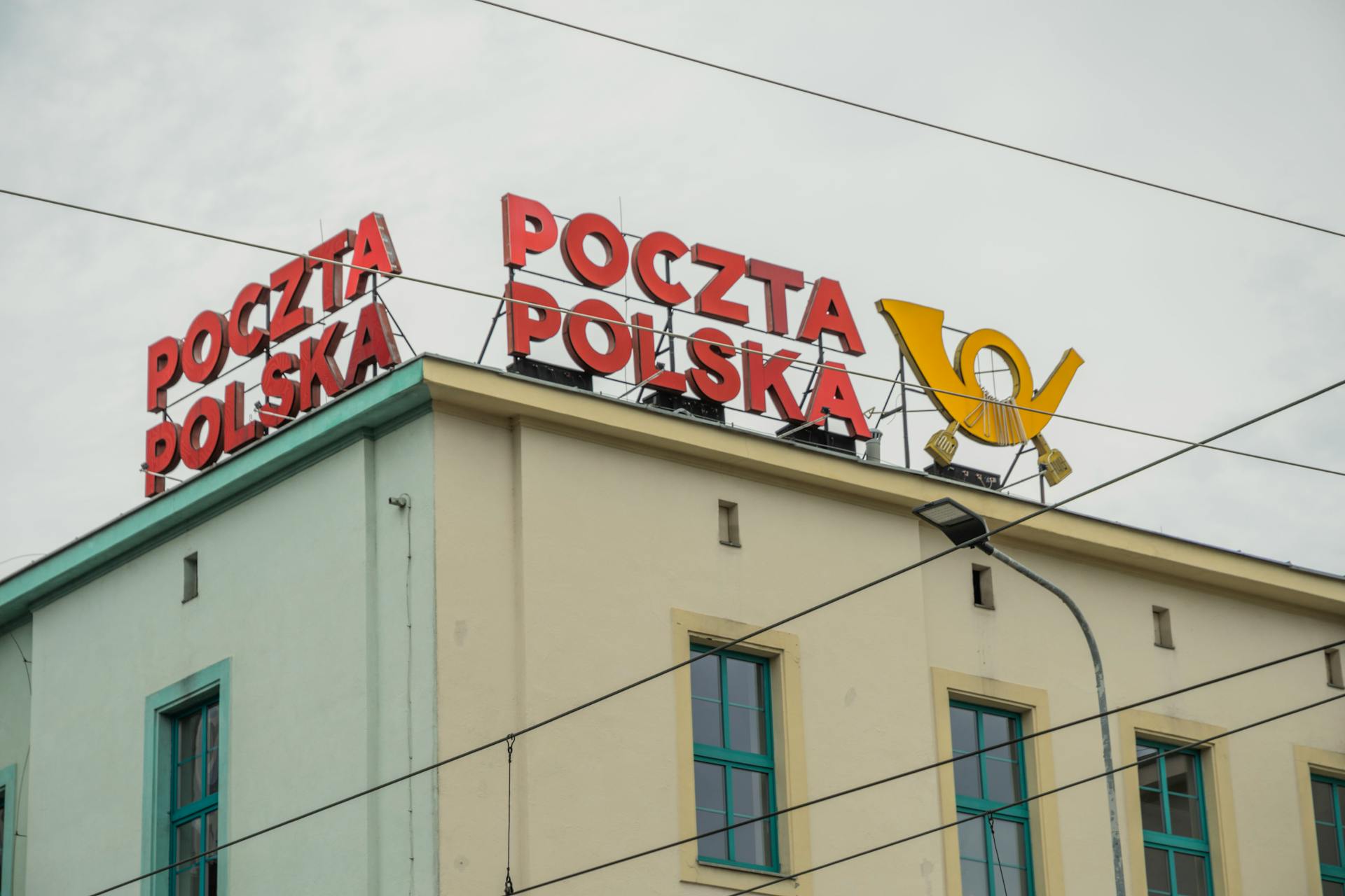 View of Poczta Polska building with iconic signage in Wrocław, Poland.