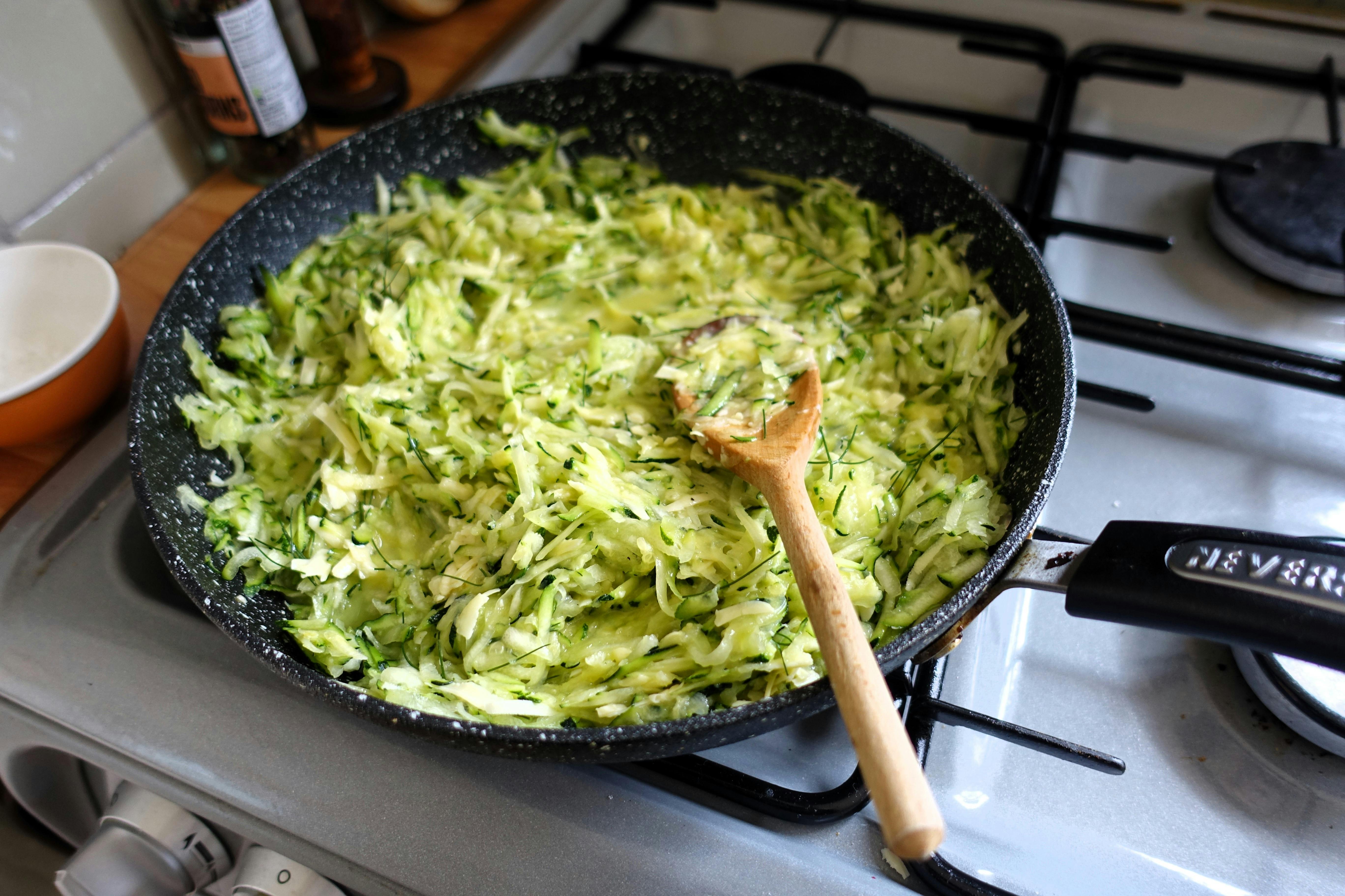 a pan with zucchini and other ingredients in it