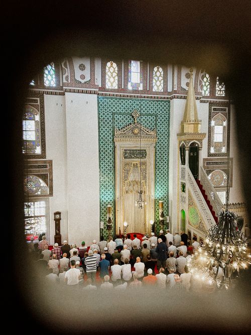 Free A group of people gathered inside a mosque in Istanbul, Türkiye, during a prayer session. Stock Photo